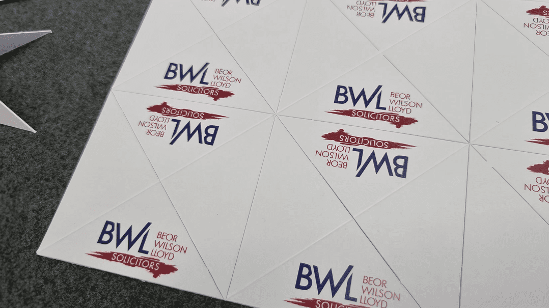 Advanced digital die cutter in operation at Low Cost Printing, enhancing efficiency and affordability in custom print projects.